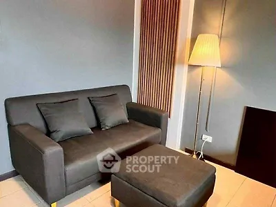 Cozy living room with modern sofa and stylish floor lamp