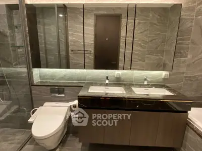 Luxurious modern bathroom with dual sinks and elegant marble finishes
