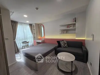 Modern studio apartment with stylish decor and natural light
