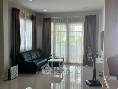 Spacious living room with modern decor and natural light