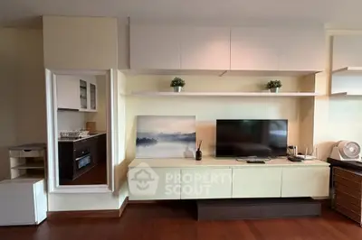 Modern living room with sleek TV unit and elegant decor