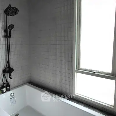 Modern bathroom with sleek bathtub and stylish shower fixtures