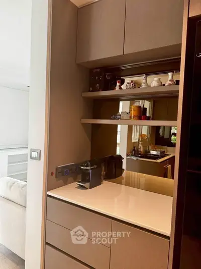 Modern kitchen nook with built-in shelves and coffee machine