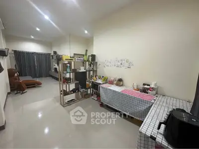 Spacious living room with modern decor and ample natural light, perfect for relaxation and entertainment.