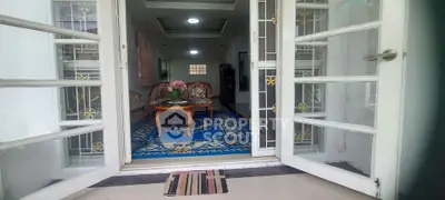 Charming entrance to a cozy living room with elegant decor and inviting ambiance.