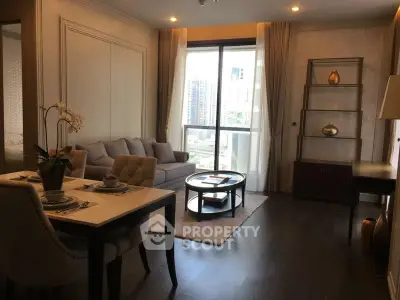 Elegant living room with modern decor and city view, featuring a cozy seating area and dining table.