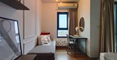 Cozy study nook with desk, chair, and window view in modern apartment