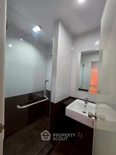 Modern bathroom with sleek design and glass shower enclosure