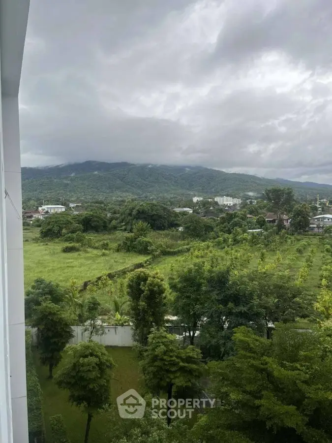 Breathtaking view of lush green landscape and mountains from a high vantage point, ideal for nature lovers.