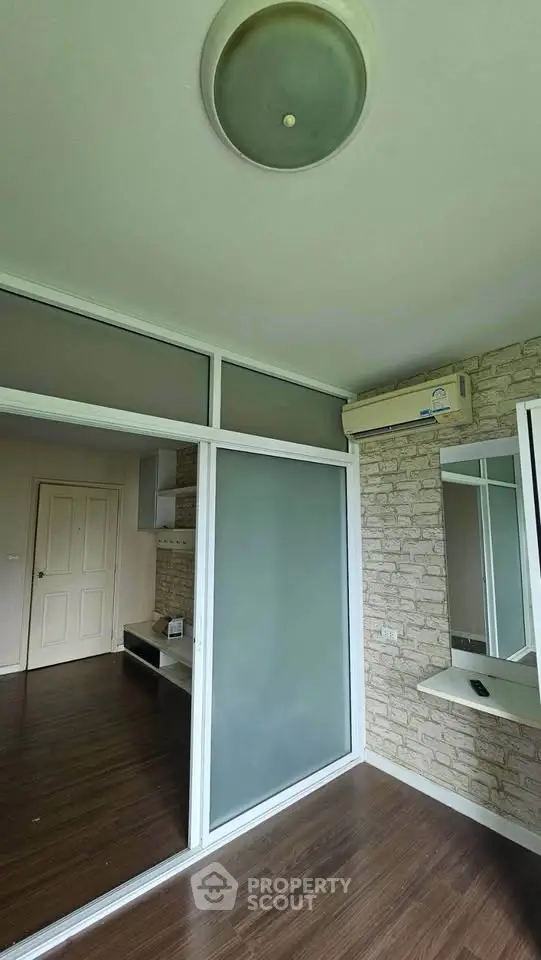 Modern interior with frosted glass partition and air conditioning in a stylish apartment.