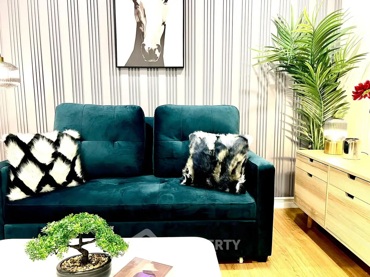 Stylish living room with plush sofa, chic decor, and modern accents