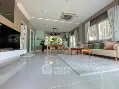 Spacious modern living room with elegant decor and large windows