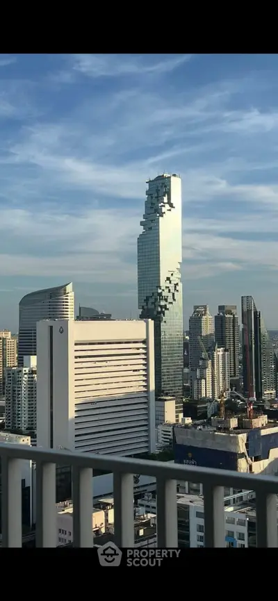 Stunning cityscape view featuring iconic skyscraper with unique architecture and urban skyline.