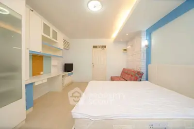 Spacious bedroom with modern furnishings and ample natural light