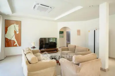 Spacious living room with modern furniture and elegant decor