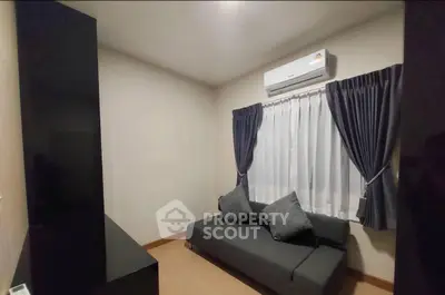 Cozy living room with modern sofa and air conditioning