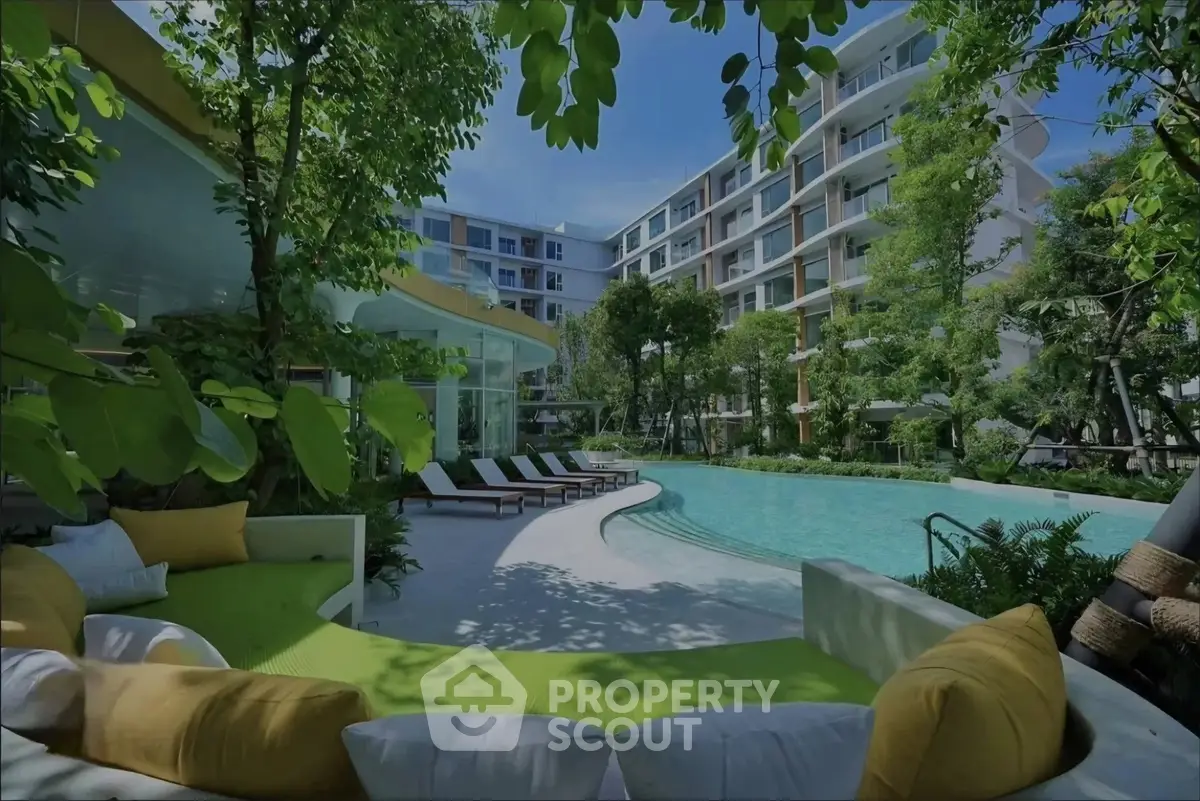 Luxurious apartment complex with stunning pool and lush greenery, perfect for relaxation and modern living.