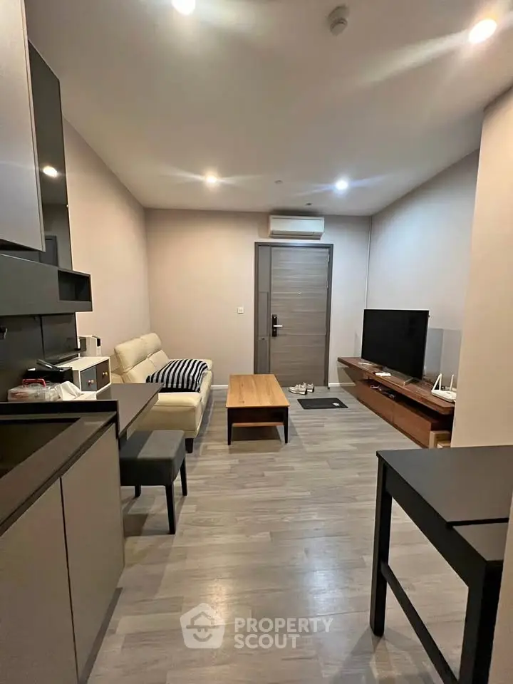 Modern living room with sleek furniture and minimalist design, perfect for urban living.