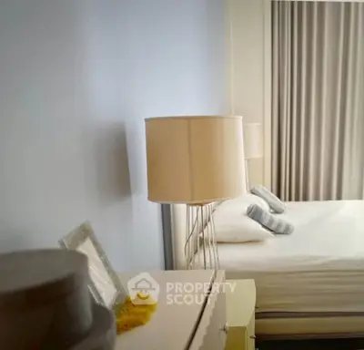 Cozy bedroom with modern decor and soft lighting, perfect for relaxation.