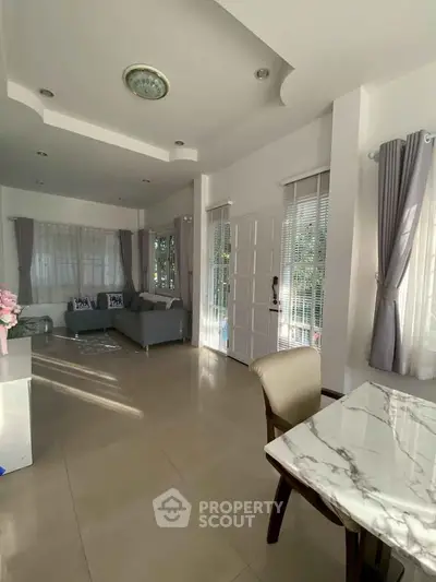 Spacious living room with elegant decor and natural light