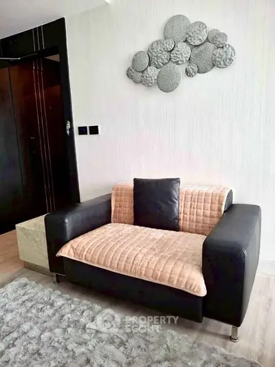 Stylish modern living room with cozy sofa and artistic wall decor