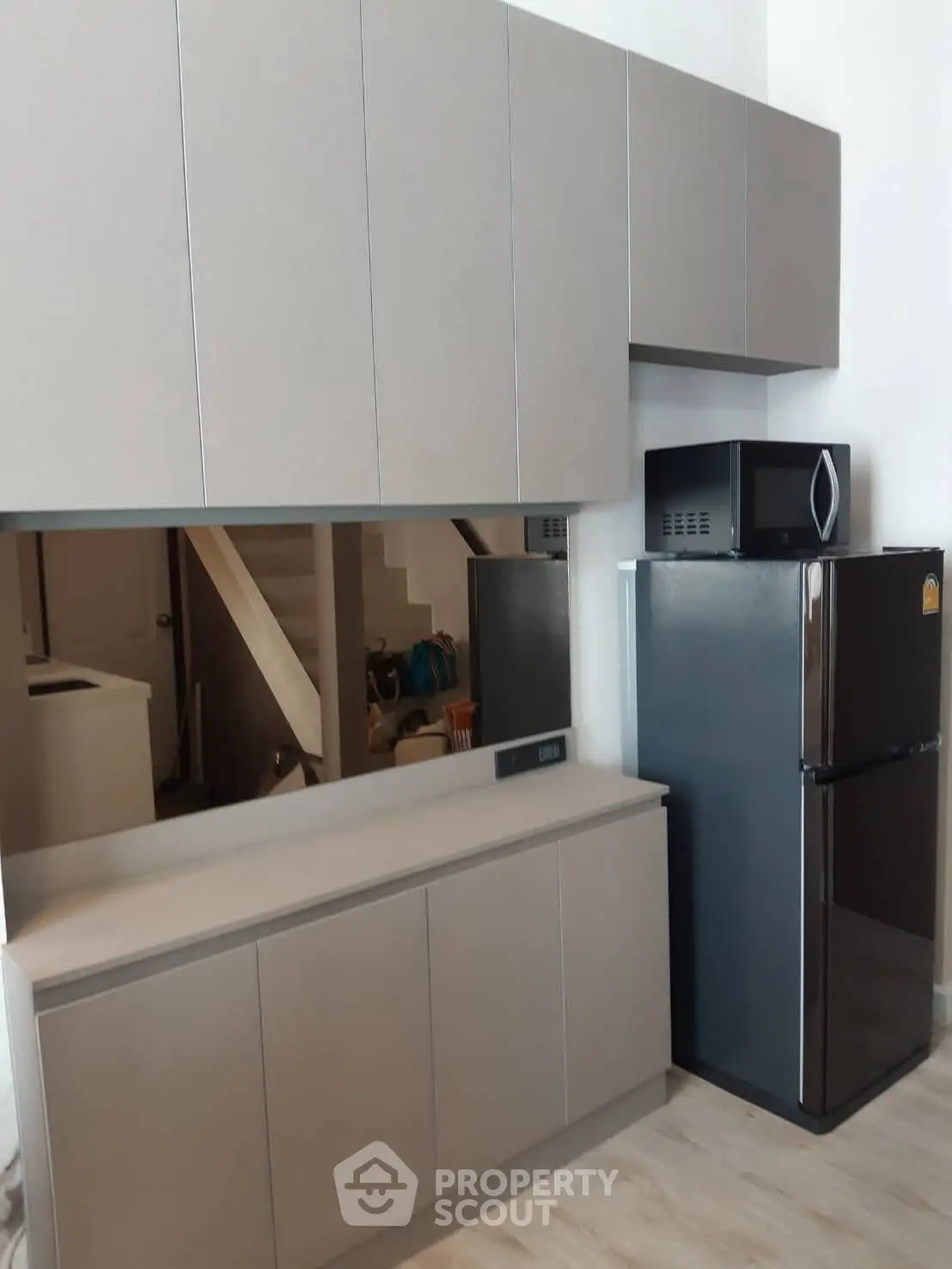 Modern kitchen with sleek cabinetry and stainless steel appliances