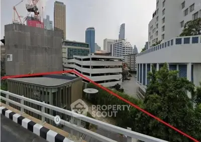 Urban cityscape with modern buildings and construction site, showcasing dynamic architectural development.