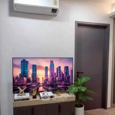 Modern living room with sleek TV setup and air conditioning unit