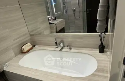 Luxurious bathroom with modern bathtub and elegant fixtures in a stylish home.