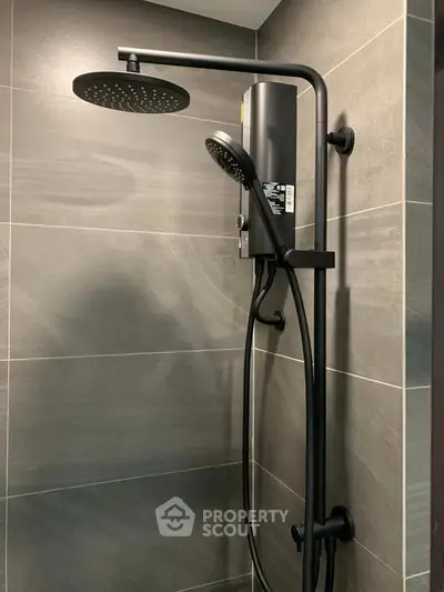 Modern bathroom shower with sleek black fixtures and elegant tile design