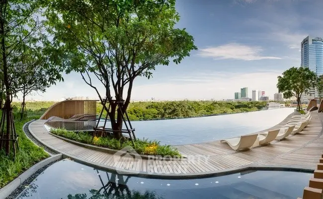 Luxurious infinity pool with stunning city skyline view and lush greenery
