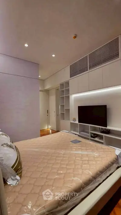 Modern bedroom with built-in storage and sleek design