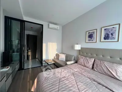 Modern bedroom with stylish decor and natural light