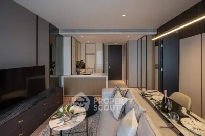 Modern living room with sleek design, open kitchen layout, and stylish decor in a luxury apartment.