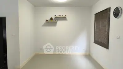 Minimalist empty room with wall shelves and window blinds
