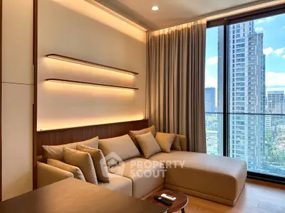 Luxurious living room with modern sofa and stunning city view through large windows.
