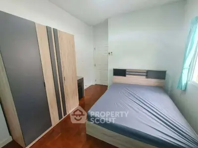 Spacious bedroom with modern wardrobe and natural light