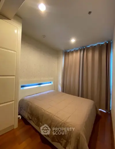 Cozy bedroom with modern lighting and elegant curtains