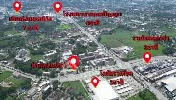 Aerial view of a real estate location with nearby amenities marked for convenience.