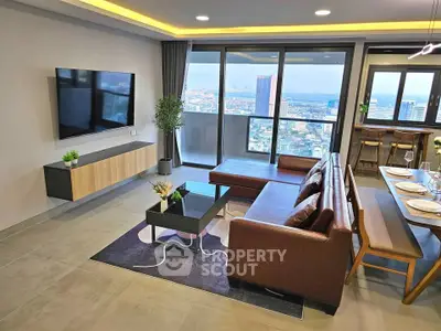 Modern living room with city view, stylish furniture, and open layout for seamless living experience.