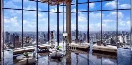 Luxurious high-rise living room with panoramic city views and modern furnishings.