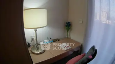 Cozy study nook with modern lamp and wooden desk in bright apartment