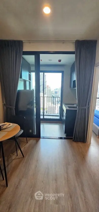 Modern apartment with balcony view and open kitchen layout