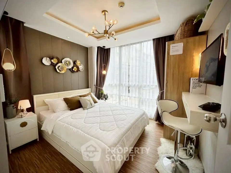 Modern bedroom with stylish decor and natural light, featuring a cozy bed and elegant lighting.