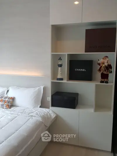 Modern bedroom with stylish shelving and luxury brand decor