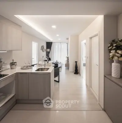 Modern open-plan kitchen and living area with sleek design and natural light.