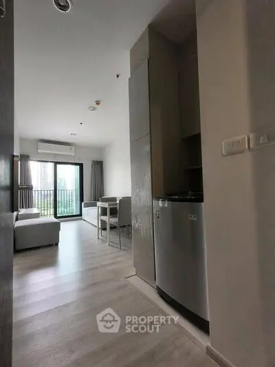 Modern apartment interior with open layout and balcony view