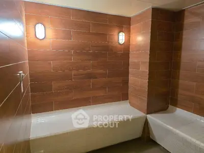 Modern bathroom with wooden tile walls and built-in seating