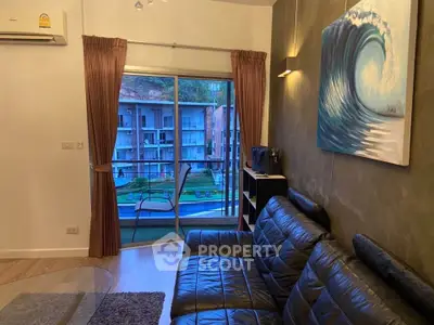 Stylish living room with leather sofa and balcony view in modern apartment