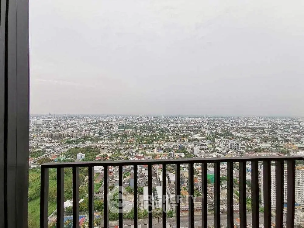 Stunning panoramic city view from high-rise balcony, perfect for urban living.